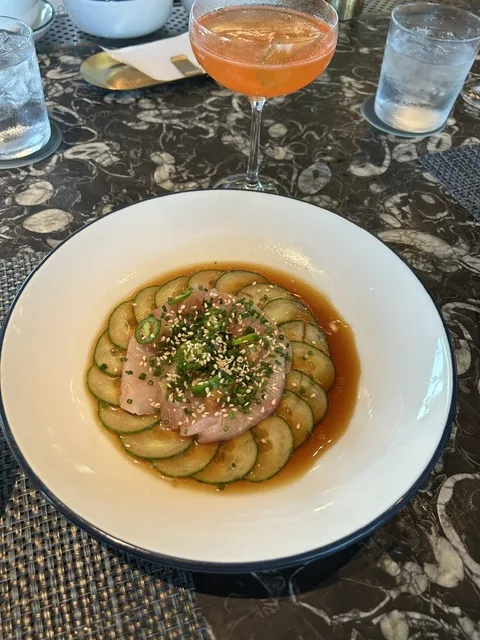 Yellowtail crudo with ponzu, sliced cucumber, jalapeño, and sesame at Even Coast Addison